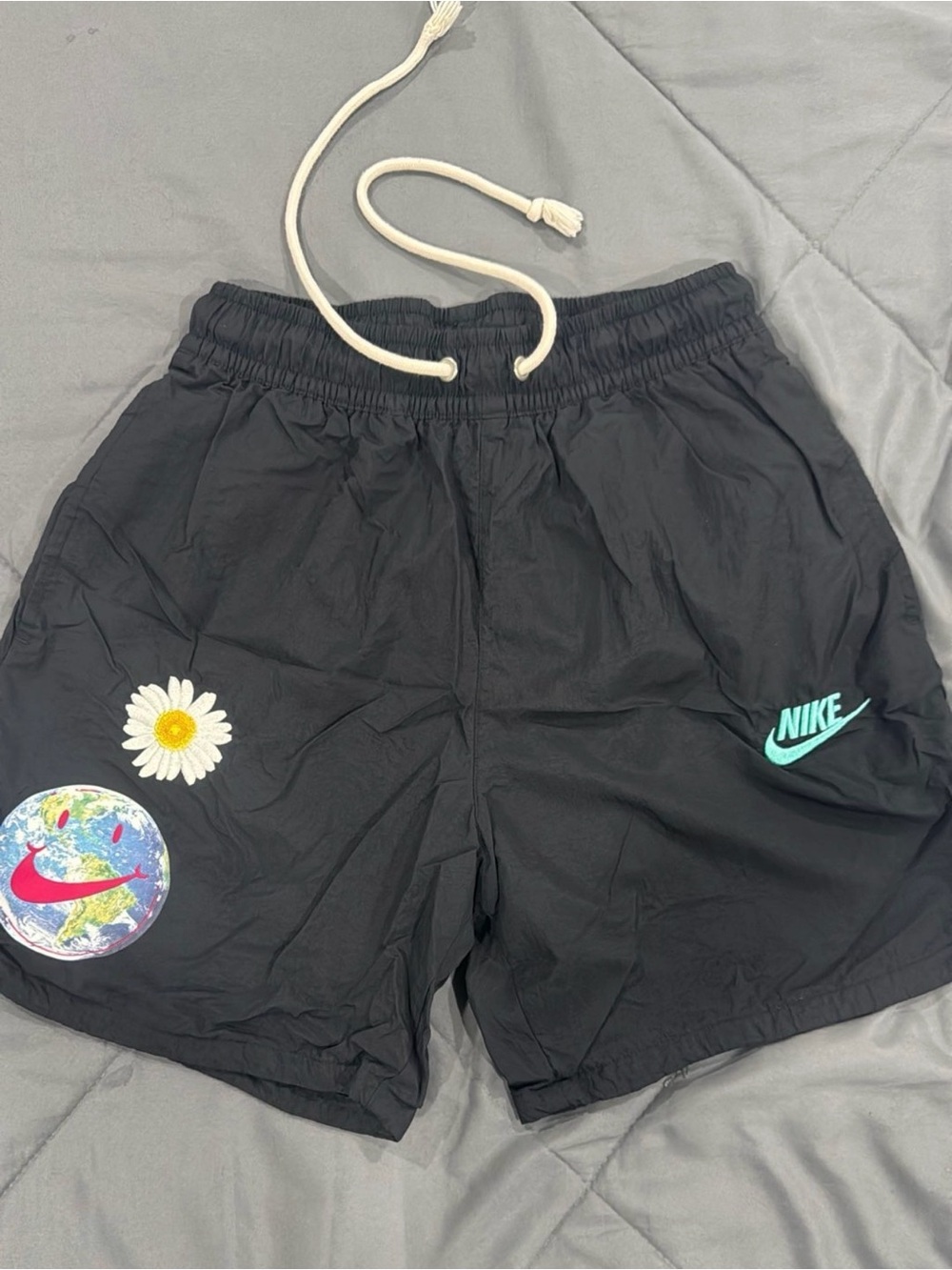 Nike Men’s Black Shorts with Teal Logo and Daisy Patch